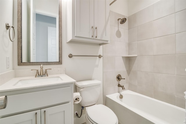 full bathroom featuring toilet, vanity, and tiled shower / bath