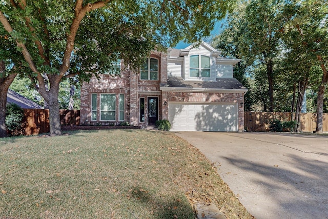 view of front facade with a garage and a front lawn