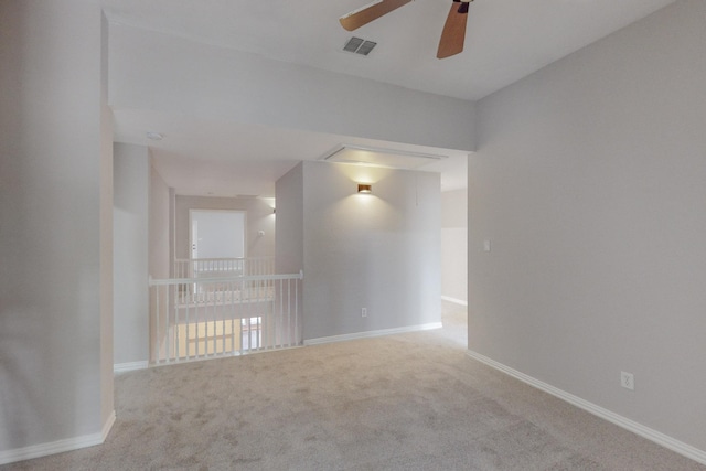 carpeted empty room with ceiling fan