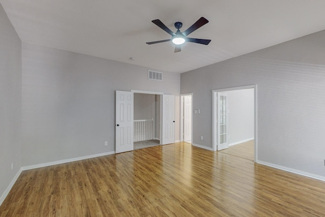 unfurnished bedroom featuring ceiling fan and light hardwood / wood-style flooring