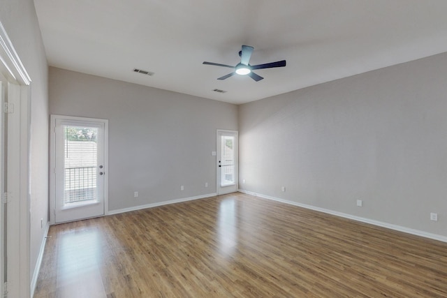 empty room with light hardwood / wood-style floors and ceiling fan