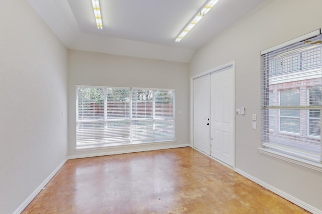 foyer featuring lofted ceiling