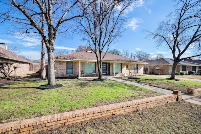 ranch-style house with a front yard