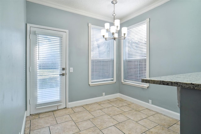 unfurnished dining area with a textured ceiling, light tile patterned floors, ornamental molding, and a chandelier