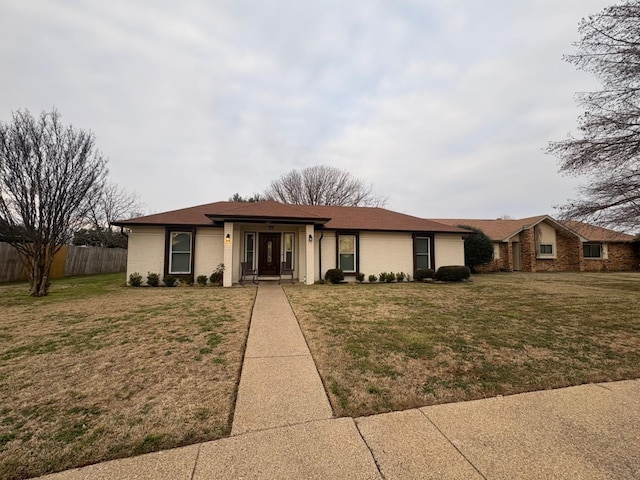 ranch-style house with a front yard