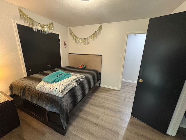 bedroom featuring hardwood / wood-style flooring