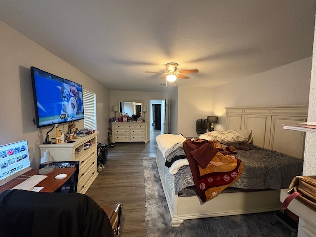 bedroom with ceiling fan, a textured ceiling, and dark hardwood / wood-style flooring