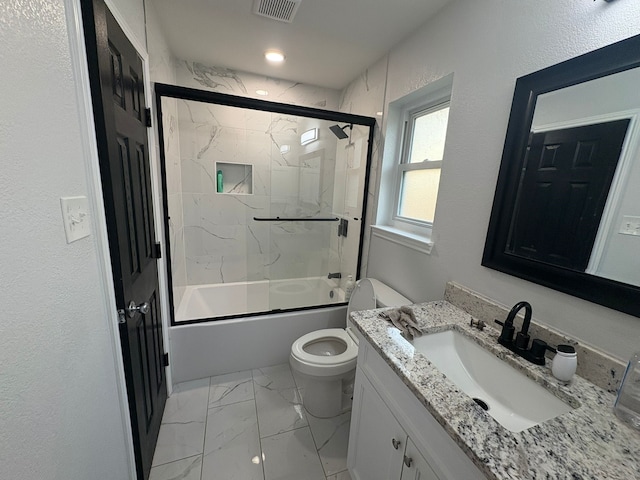 full bathroom featuring vanity, toilet, and enclosed tub / shower combo