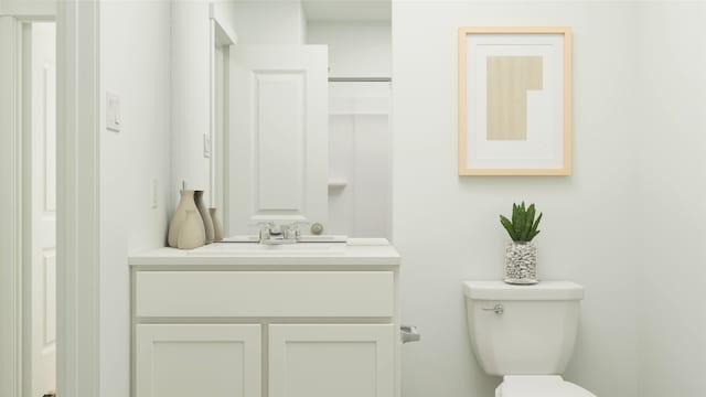 bathroom featuring vanity and toilet