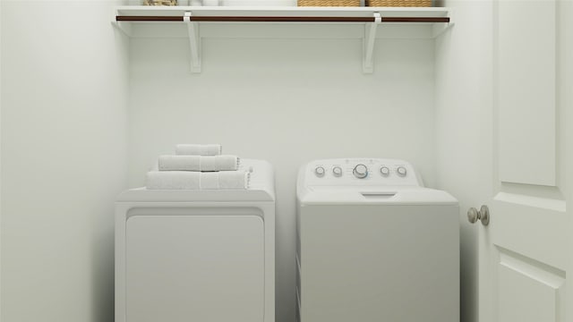 washroom with independent washer and dryer