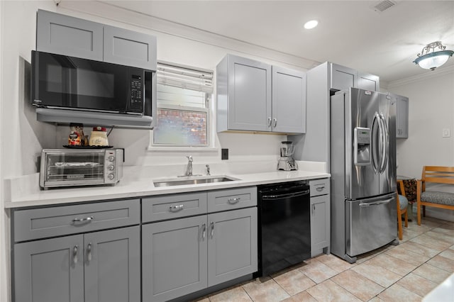 kitchen featuring sink, gray cabinetry, light tile patterned floors, black appliances, and crown molding