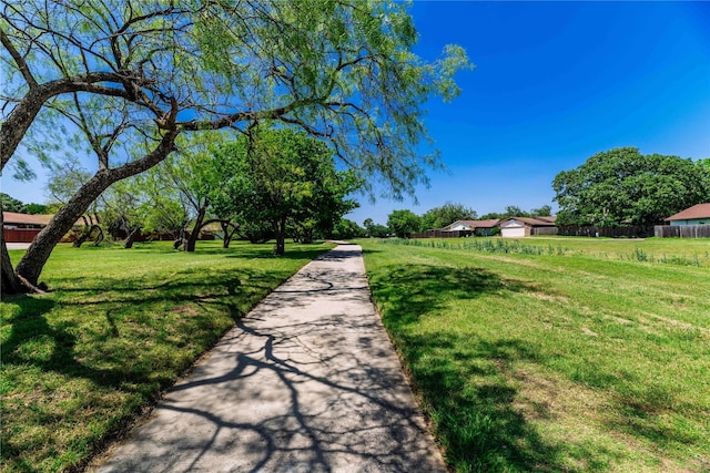 view of property's community featuring a lawn