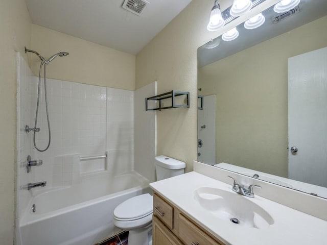 full bathroom featuring toilet, vanity, and washtub / shower combination