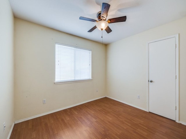 spare room featuring ceiling fan and wood-type flooring