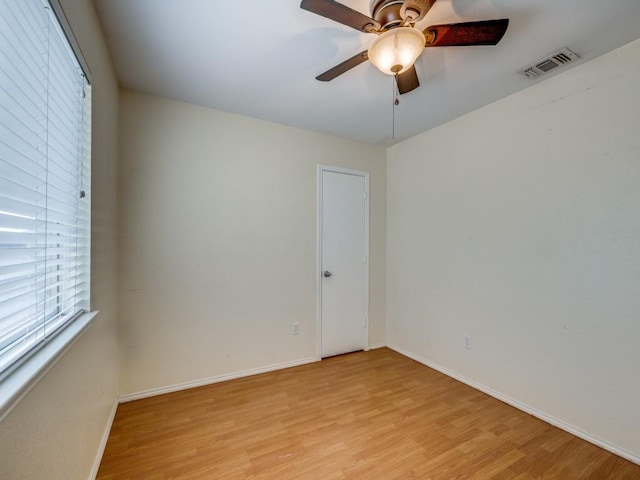 spare room with ceiling fan and light hardwood / wood-style floors