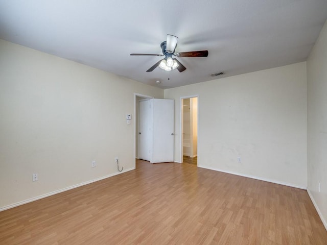 unfurnished room featuring light wood-type flooring and ceiling fan