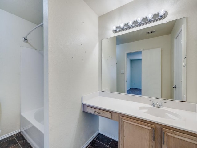 bathroom featuring bathing tub / shower combination and vanity