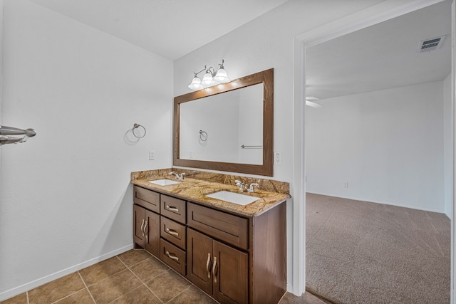 bathroom with vanity and tile patterned flooring