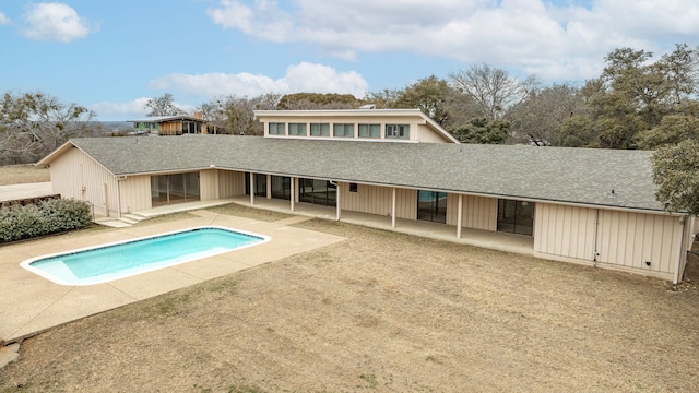 rear view of property featuring a patio area