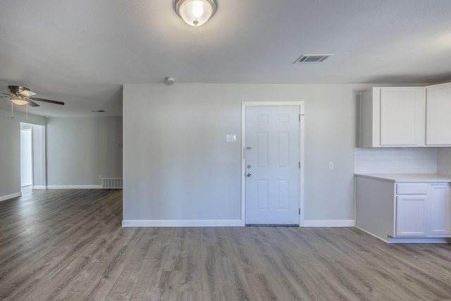 interior space with ceiling fan and light wood-type flooring