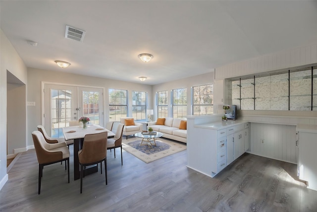 interior space with french doors and dark wood-type flooring