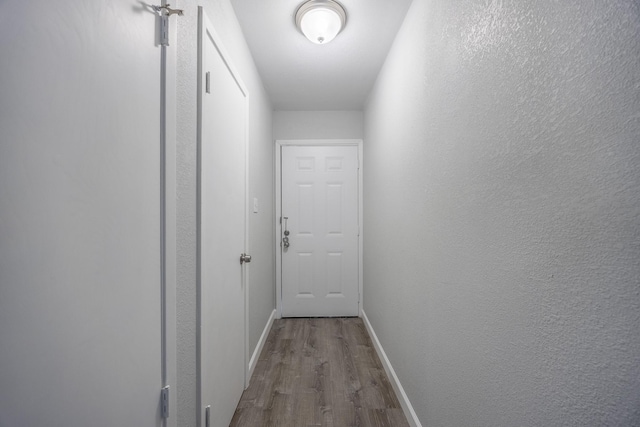 hall featuring wood-type flooring