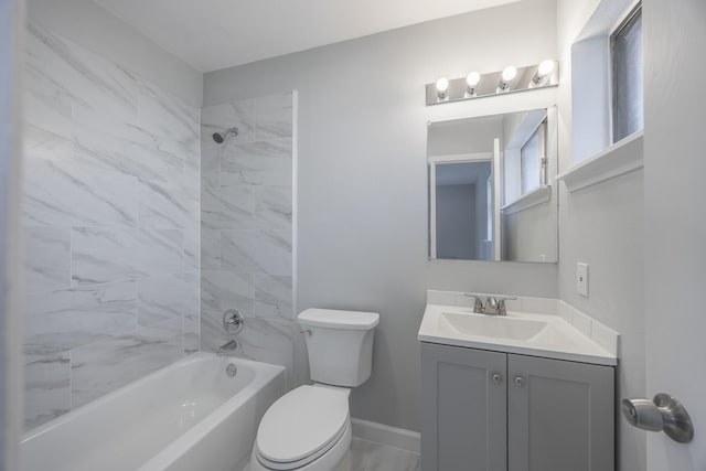 full bathroom featuring toilet, tiled shower / bath, and vanity