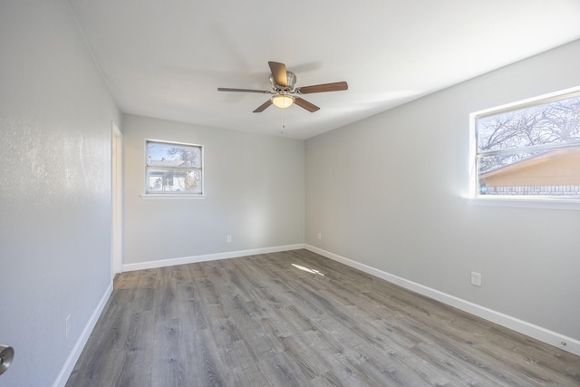 empty room with light hardwood / wood-style floors and ceiling fan