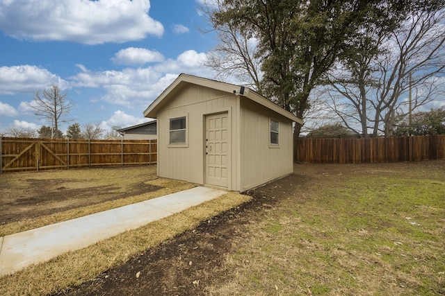 view of outbuilding with a yard