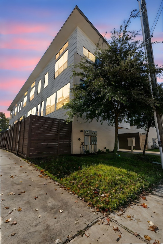 view of outdoor building at dusk