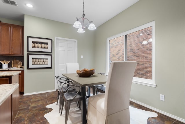 dining room featuring a notable chandelier