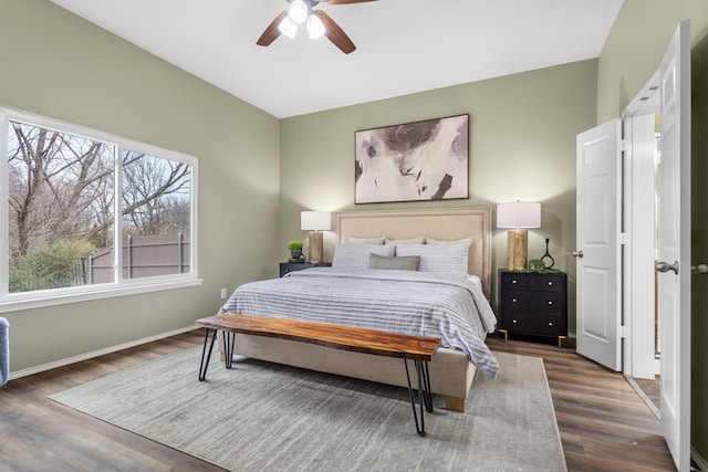 bedroom featuring ceiling fan and dark hardwood / wood-style floors