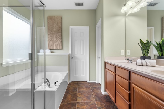 bathroom featuring vanity and shower with separate bathtub