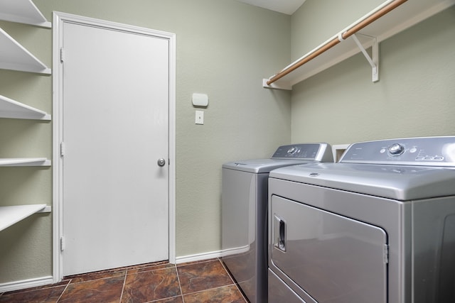 washroom featuring washer and clothes dryer