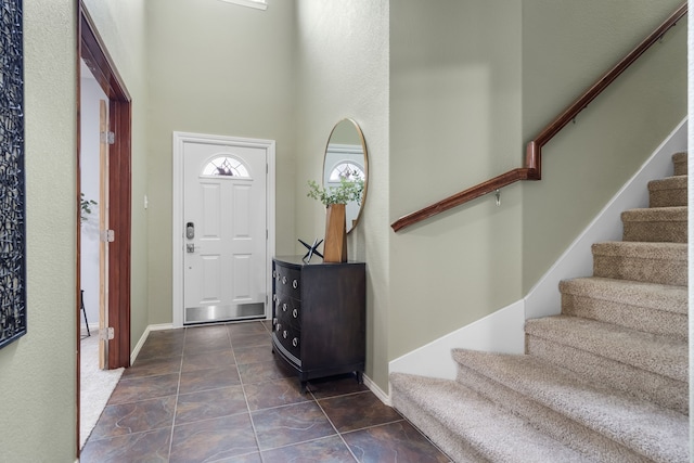 entrance foyer with a towering ceiling