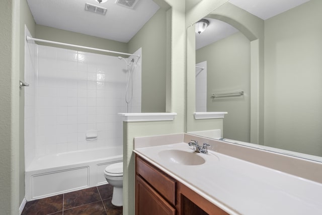 full bathroom with toilet, vanity, and tiled shower / bath combo