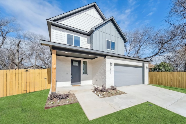 view of front facade featuring brick siding, concrete driveway, board and batten siding, a front yard, and fence