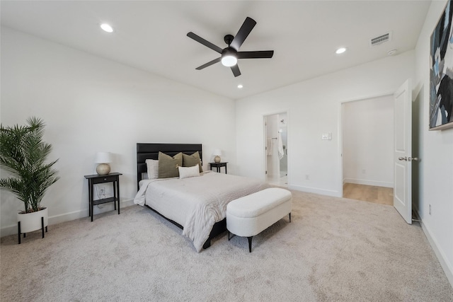 carpeted bedroom featuring recessed lighting, visible vents, and baseboards