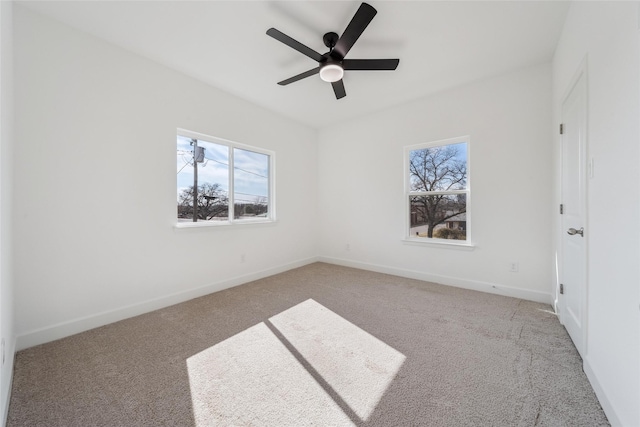 unfurnished bedroom featuring carpet, ceiling fan, and baseboards