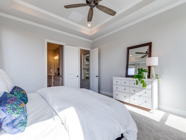 bedroom featuring a raised ceiling, ornamental molding, carpet floors, and ceiling fan