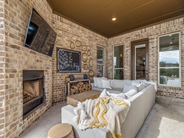 view of patio featuring an outdoor brick fireplace