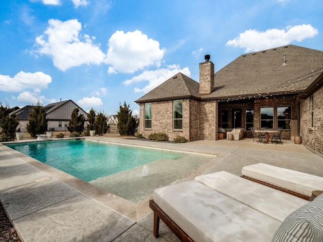 view of pool featuring a patio