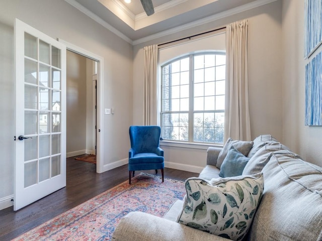 sitting room with french doors, ornamental molding, plenty of natural light, and dark hardwood / wood-style floors