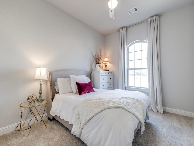 bedroom featuring lofted ceiling, light carpet, and ceiling fan