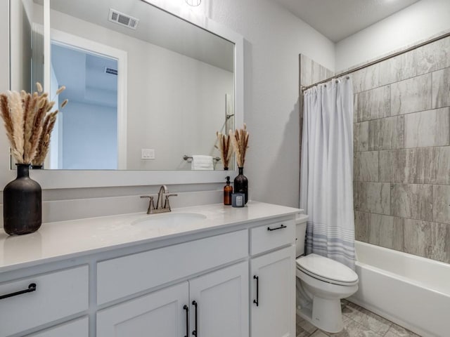 full bathroom featuring shower / tub combo with curtain, vanity, and toilet