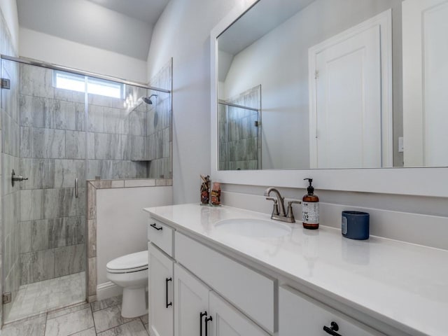 bathroom with vanity, toilet, and walk in shower