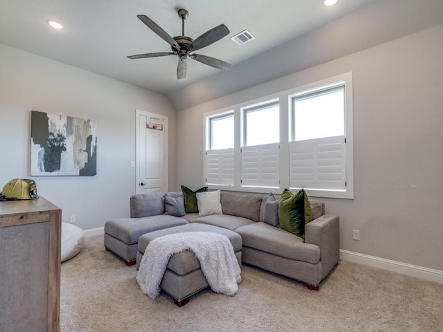 living room featuring light carpet and ceiling fan