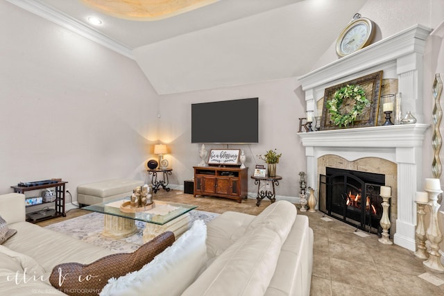 living room with crown molding, a tiled fireplace, light tile patterned floors, and lofted ceiling