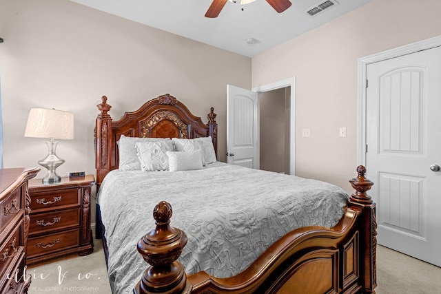 bedroom with ceiling fan and light carpet