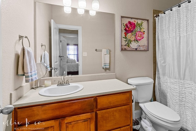 bathroom with vanity and toilet